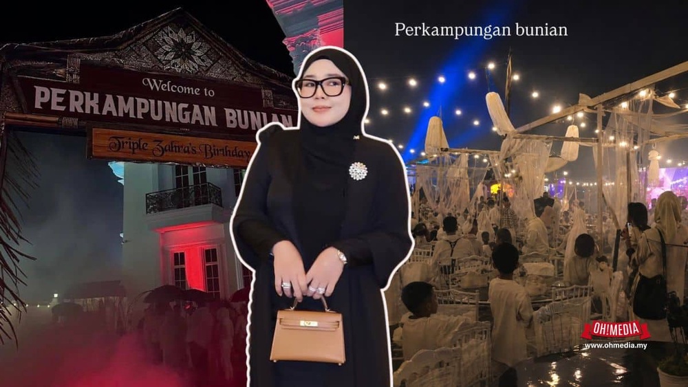 A woman in black attire and glasses stands in front of a nighttime wedding venue with festive lights and a sign reading 'Perkampungan Bunian'.