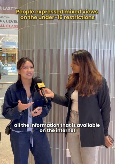 Two women in a mall interview; one holds a microphone and speaks while the other listens, with a bold headline about under-16 restrictions above them.