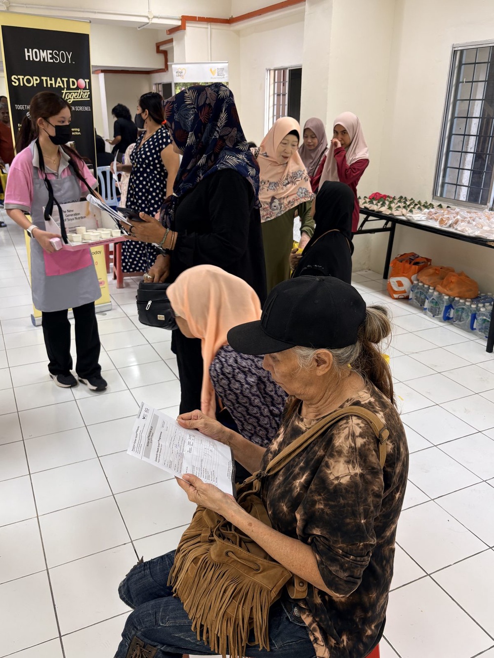Women at a HOMESOY and NCSM community breast cancer screening activation in Malaysia