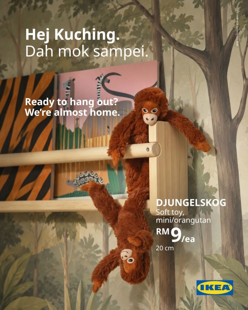 Two IKEA Kuching DJUNGELSKOG mini orangutan soft toys hanging from a wooden children's bookshelf, priced at RM9 each