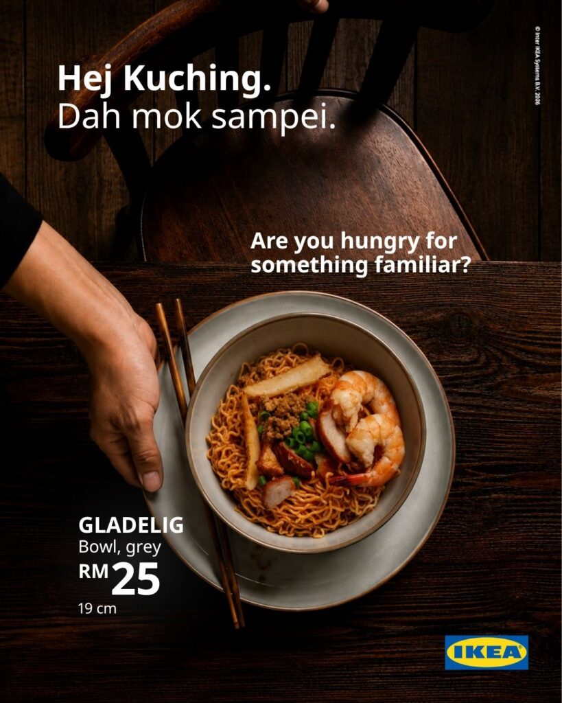 IKEA Kuching GLADELIG grey bowl filled with noodles, prawns and fish cake on a dark wooden table, priced at RM25