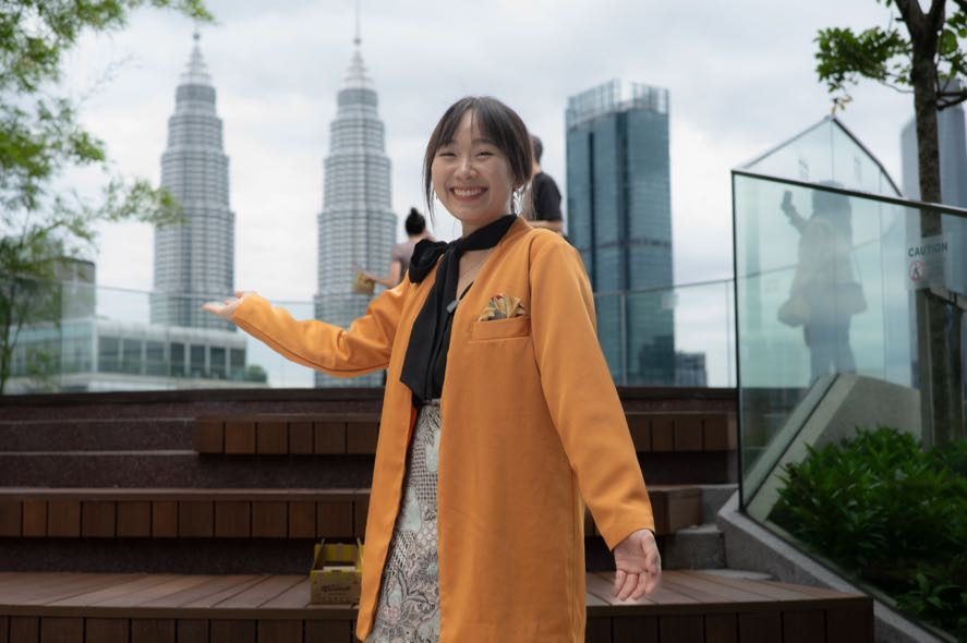 Guest with the Petronas Twin Towers in the background in Kuala Lumpur city centre