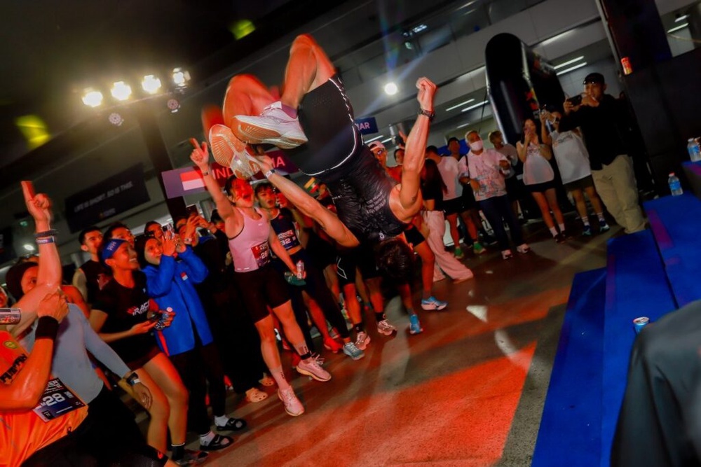 An athlete celebrates with a backflip at Red Bull Power Race