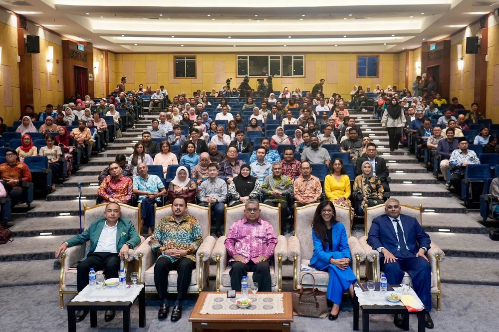 May be an image of one or more people, people studying, crowd and text