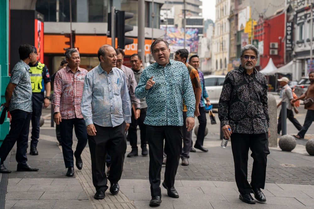 May be an image of one or more people and street