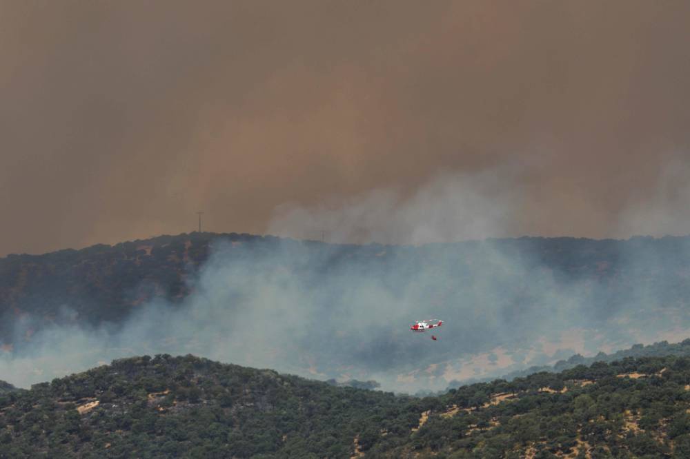 Image from: Two wildfires merge near Madrid, 19,000 evacuated or confined