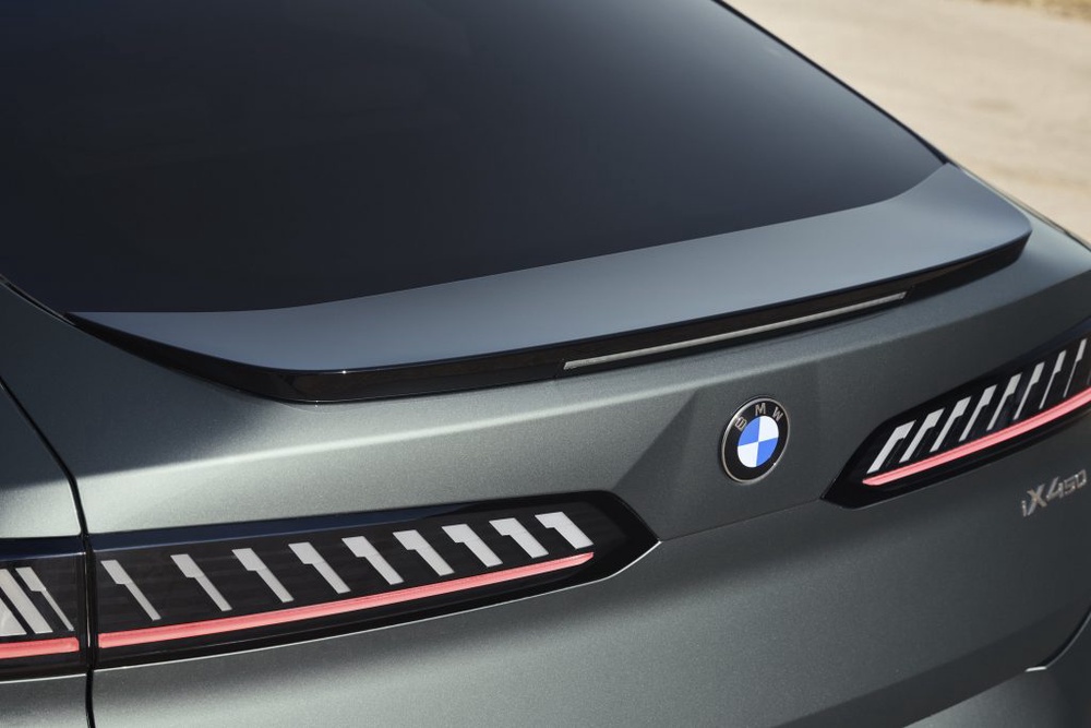 Image from: First-ever BMW iX4: Coupe-style electric SUV with 828km range and 400kW DC charging