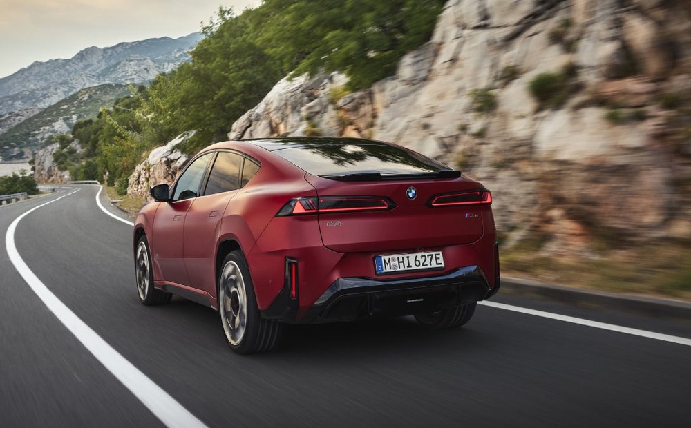 Image from: First-ever BMW iX4: Coupe-style electric SUV with 828km range and 400kW DC charging