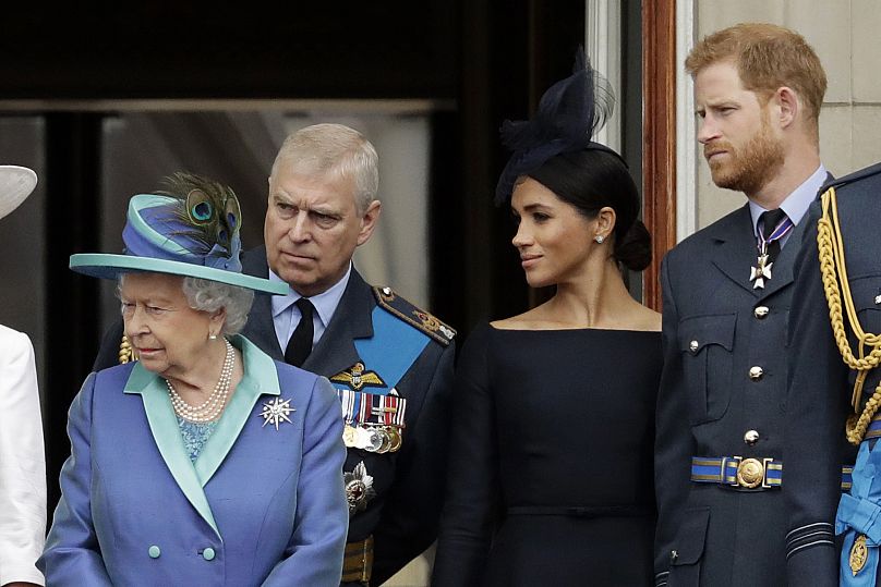 Queen Elizabeth II, Prince Andrew, Meghan and Prince Harry watch an RAF flypast from Buckingham Palace on 10 July 2018. (AP Photo/Matt Dunham)