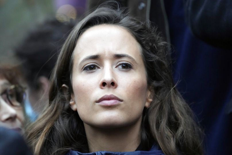 Clemence Guette, member of La France Insoumise looks on during a protest for salary increase, in Paris, France, Thursday, Jan. 27, 2022