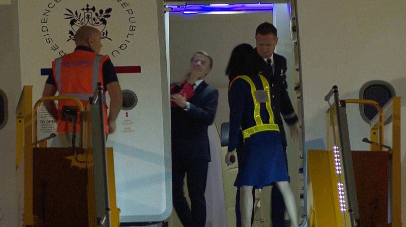 In this grab taken from video France's President Emmanuel Macron prepares to disembark a plane on arrival in Hanoi, 25 May, 2025