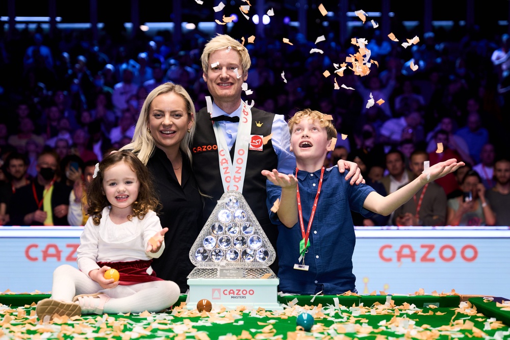 Neil Robertson celebrates his 2022 Masters triumph at Alexandra Palace alongside his wife Mille, daughter Penelope and son Alexander (John Walton/PA) (PA Wire)