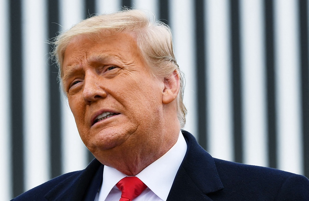 In this file photo taken on January 12, 2021 US President Donald Trump speaks following a section of the border wall in Alamo, Texas (AFP via Getty Images)