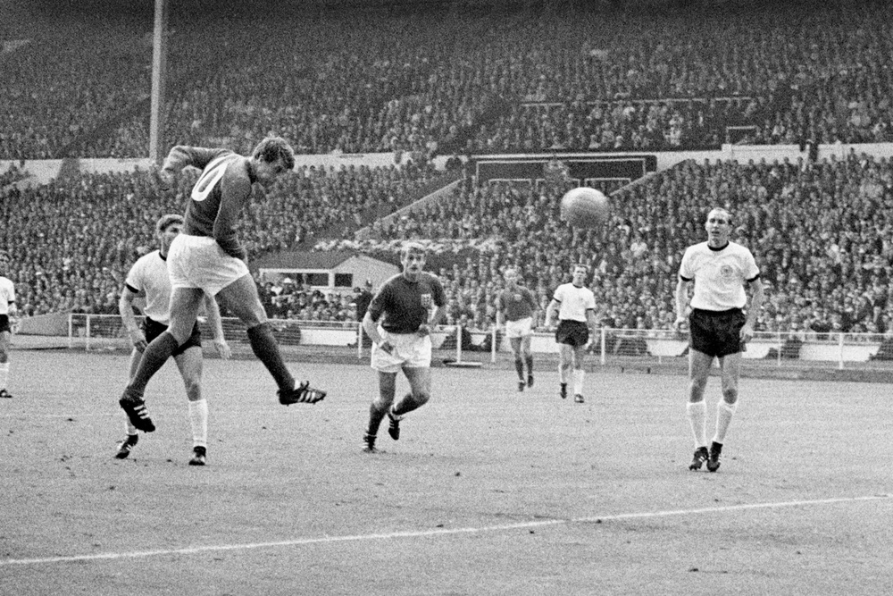 England’s Geoff Hurst heads the equaliser in the 1966 World Cup final (PA)