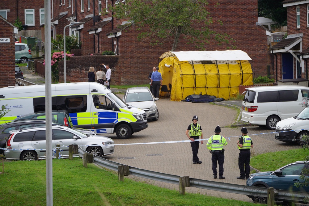 Police in Biddick Drive, Plymouth, following the shootings (PA Archive)