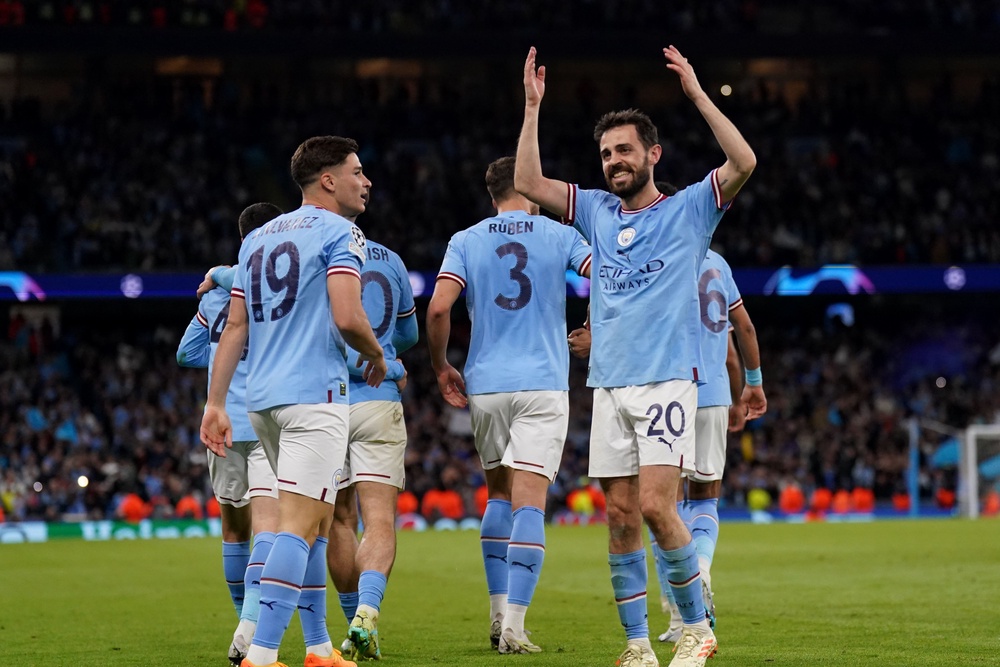Manchester City’s Julian Alvarez celebrates scoring his sides fourth goal with fellow scorer Bernardo Silva during the UEFA Champions League semi-final second leg match at Etihad Stadium, Manchester. Picture date: Wednesday May 17, 2023. (PA Wire)