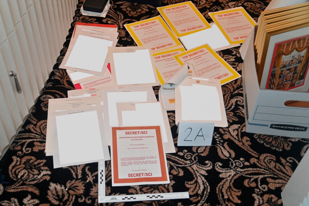This image contained in a court filing by the Department of Justice on Aug. 30, 2022, and partially redacted by the source, shows a photo of documents seized during the Aug. 8, 2022, FBI search of former President Donald Trump's Mar-a-Lago estate. (AP)