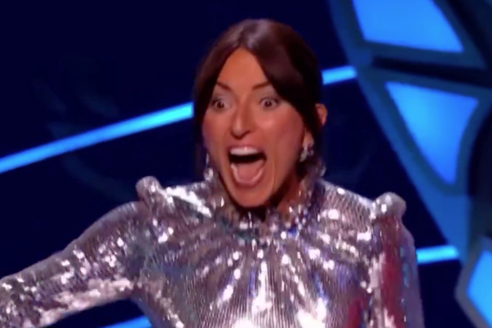 The Masked Singer Davina McCall runs across stage screaming over