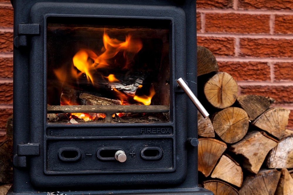 Researchers have warned that burning wood indoors could cause damage akin to cigarette smoke (PA)