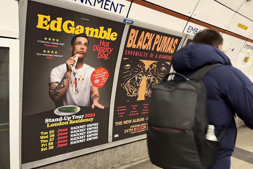 A poster advertising Ed Gamble’s Hot Diggity Dog tour on the Bakerloo line (PA)