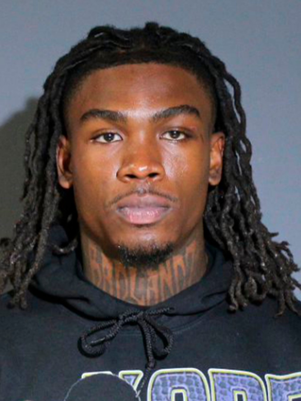 Video from KDFW showed the NFL star walking backward inside the jail, then smiling as he made a run for it out the door (AP)