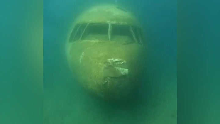 Deep sea footage shows inside sunken passenger plane mistaken for ...