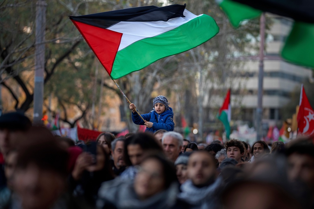 Demonstrators march in support of Palestinians in Barcelona (AP)