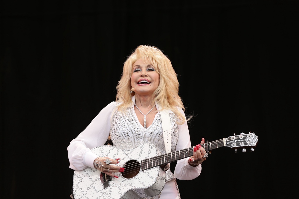Dolly Parton performing at Glastonbury Festival (PA)