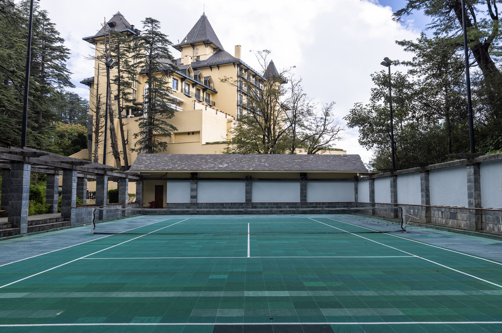 The hotel is set in 22 acres of pine and cedar woods, so playing tennis here is a serene experience (Wildflower Hall)