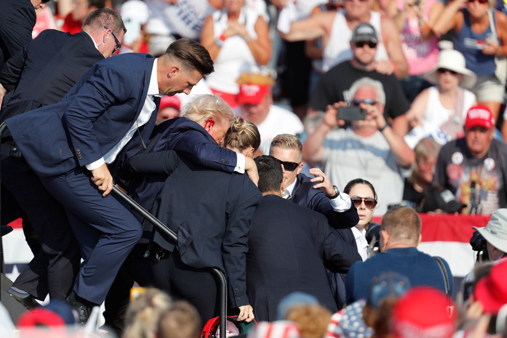 A bullet grazed Trump’s right ear, killed rally attendee Corey Comperatore and injured two others (EPA)