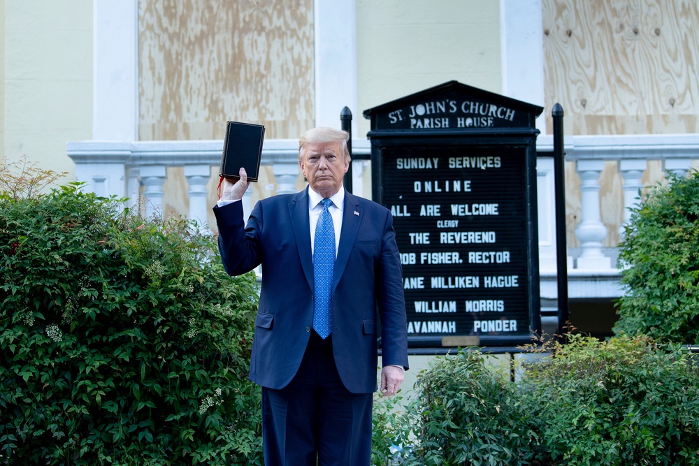 Donald Trump appeared to hold a bible upside down as he posed with one outside of St. John’s Church in Washington, D.C. in 2020 (AFP via Getty Images)