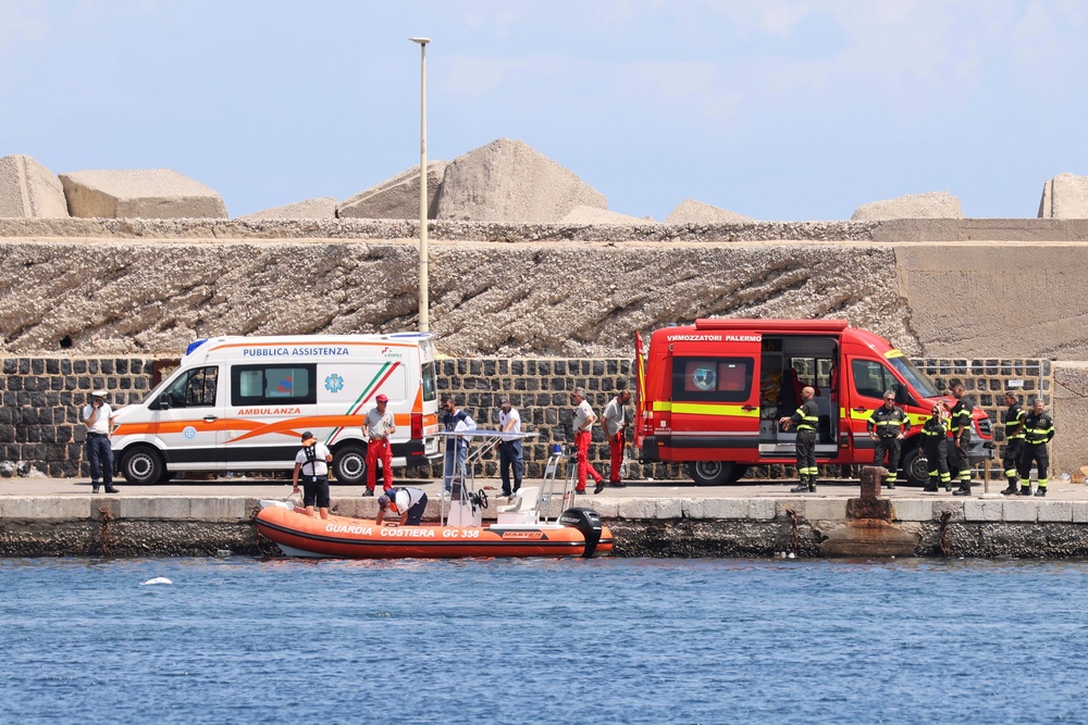 Emergency services at the scene of the search for a missing boat, in Porticello Santa Flavia, Italy, (AP)
