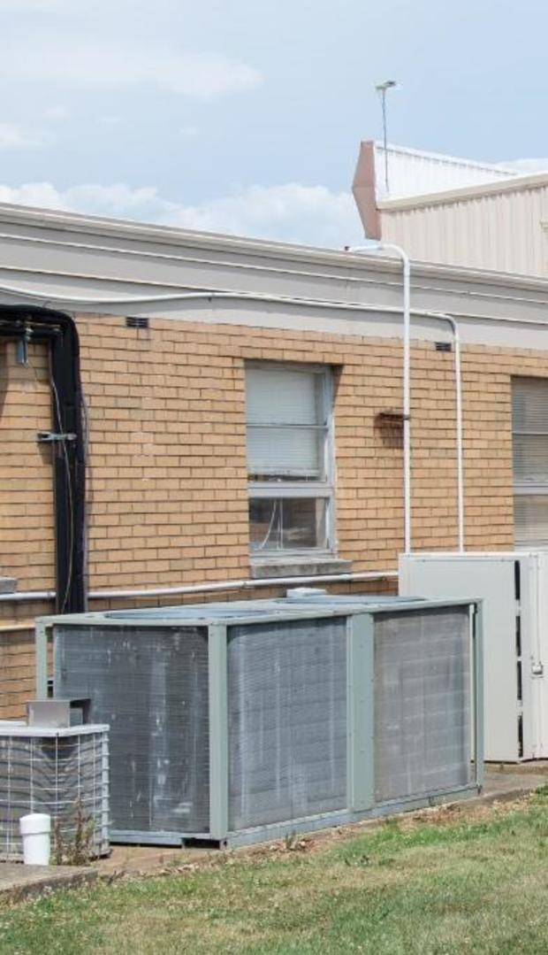 Thomas Crooks used the white air conditioning unit on the right to climb onto the roof of the building to take aim at Trump (FBI)