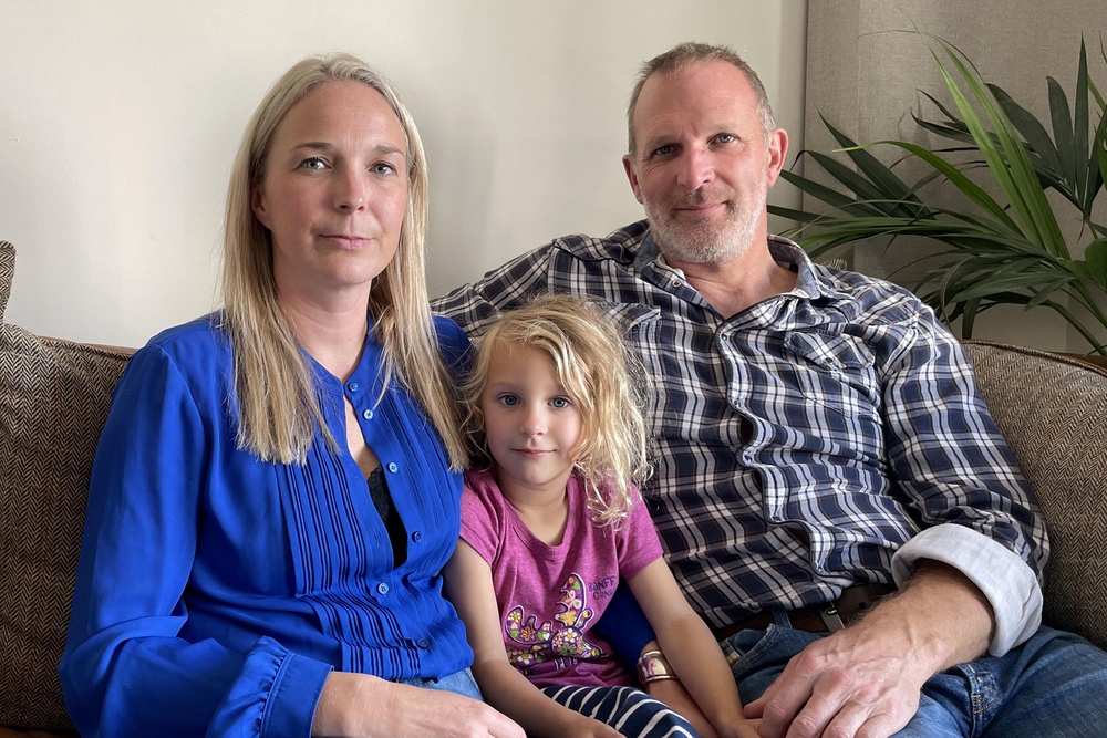 Dr Jack and Sarah Hawkins, whose first daughter was stillborn,  with their daughter Lottie (PA)