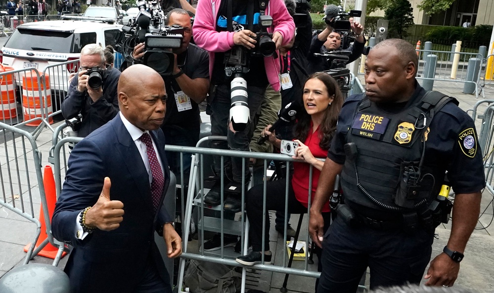 Eric Adams gives a thumbs-up as he arrives at Manhattan federal court on </div></div></div><div class=