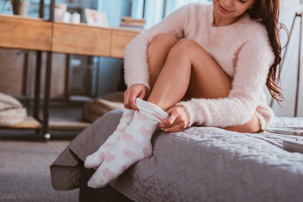 Warm feet play a major role in contributing towards your body temperature (Alamy/PA)