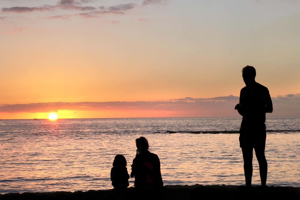 A family watching sunset on Fanabe beach, Costa Adeje, Tenerife