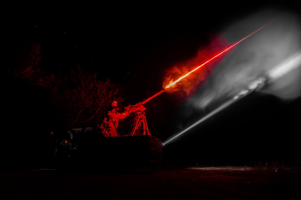 Ukrainian serviceman fires machine gun during training in the Kherson region (AP)
