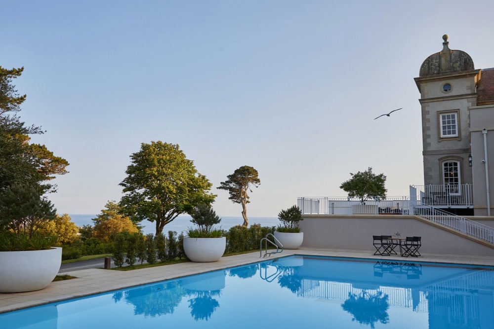 An outdoor pool provides panoramic views of the ocean (Fowey Hall)