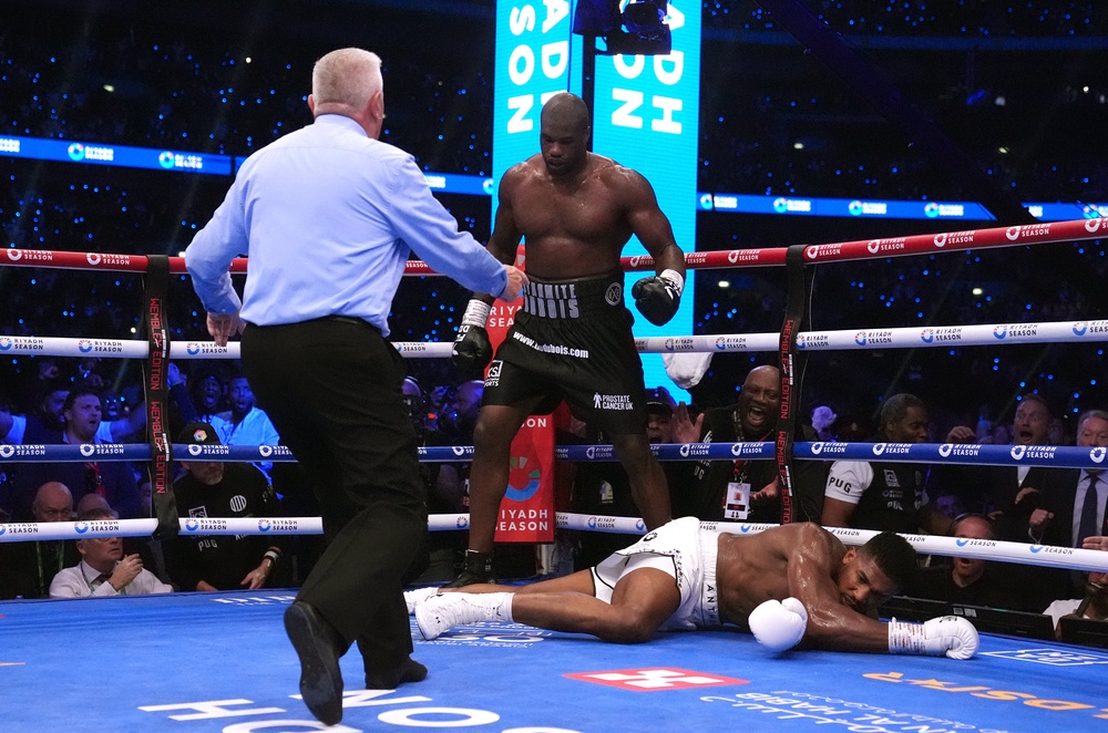 Daniel Dubois (centre) handed Anthony Joshua his fourth career loss and second by stoppage (PA Wire)