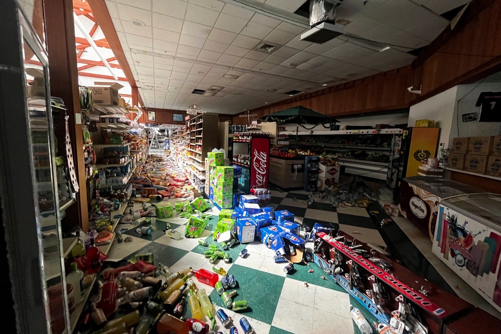 Drinks and other food items are toppled on the floor inside Hoby’s Market and Deli on Thursday in Scotia, California. The 7.0 earthquake largely inflicted minor damage ((Dylan McNeill/The Times-Standard via AP))