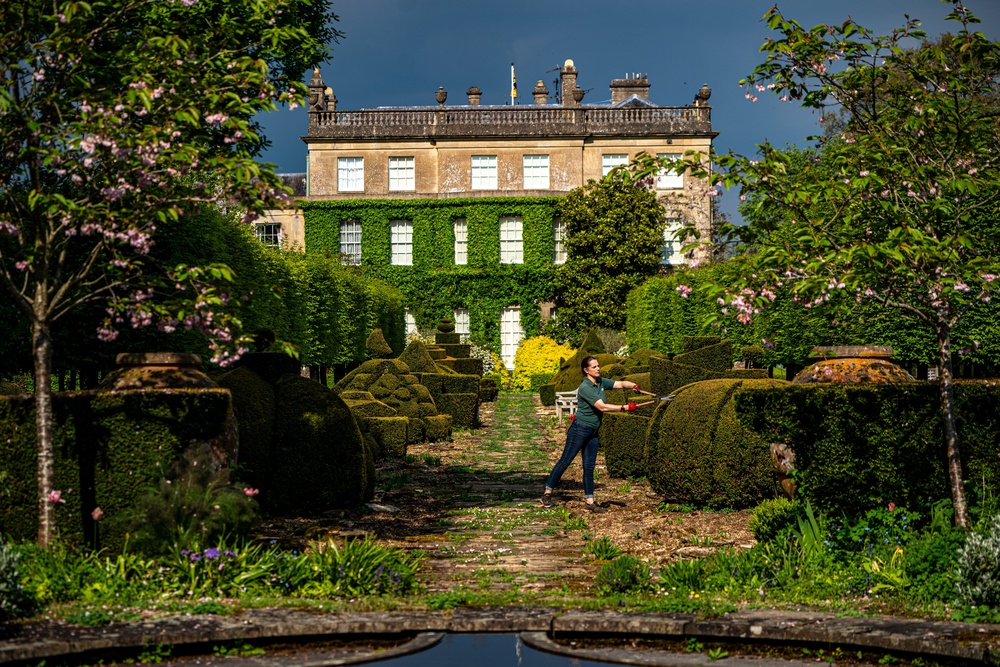 A gardener tends to topiary bushes in the gardens of Highgrove in Gloucestershire (PA Archive)