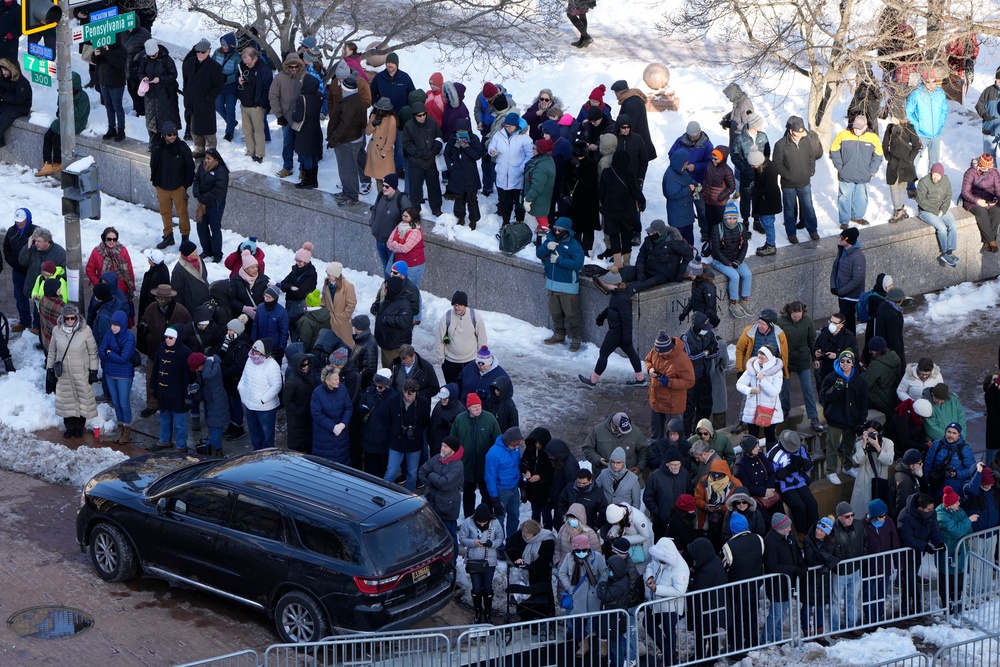 Spectators wait for the casket of former President Jimmy Carter to arrive at the U.S. Navy Memorial before traveling on to the Capitol on January 7, 2025 in Washington, DC (Getty Images)