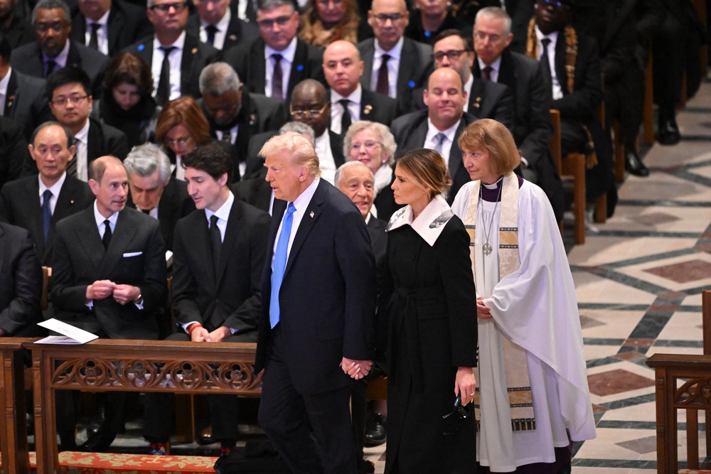 US President-elect Donald Trump and former First Lady Melania Trump arrive to atte</div></div></div><div class=