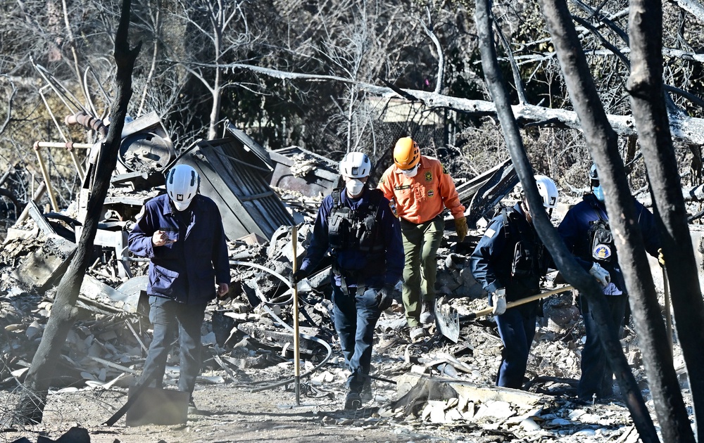 Search and rescue operations are underway amid the rubble of fire-ravaged homes demolished by the Eaton Fire in Altadena, California, on Wednesday. Teams were nearly done there (AFP via Getty Images)