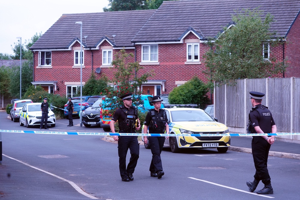 Police near Rudakubana’s home in Old School Close, Banks, near Southport, the day after the murders (PA)