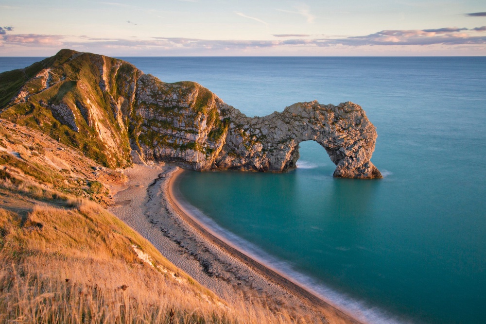 It’s worth waking up in time for sunrise at Durdle Door in Dorset (Getty Images)