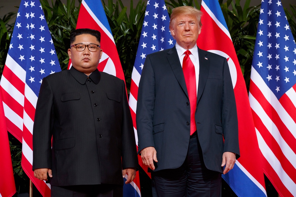 File: Us president Donald Trump, right, meets with North Korean leader Kim Jong Un on Sentosa Island, in Singapore, 12 June 2018 (AP)