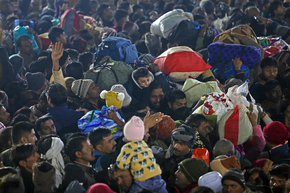 Pilgrims crowd near the site of a stampede during Maha Kumbh Mela festival in Prayagraj on 29 January 2025 (AFP via Getty Images)