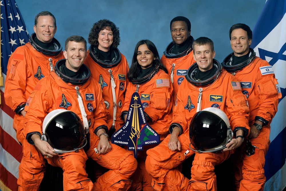 The crew of Space Shuttle Columbia's mission, who died on 1 February, 2003 when their spacecraft broke up on reentry. Front row, left to right: Mission commander Rick D. Husband (L), mission specialist Kalpana Chawla, and pilot William C. McCool. Standing, left to right: mission specialists David M. Brown, Laurel B. Clark, and Michael P. Anderson; payload specialist Ilan Ramon (NASA/Getty Images)